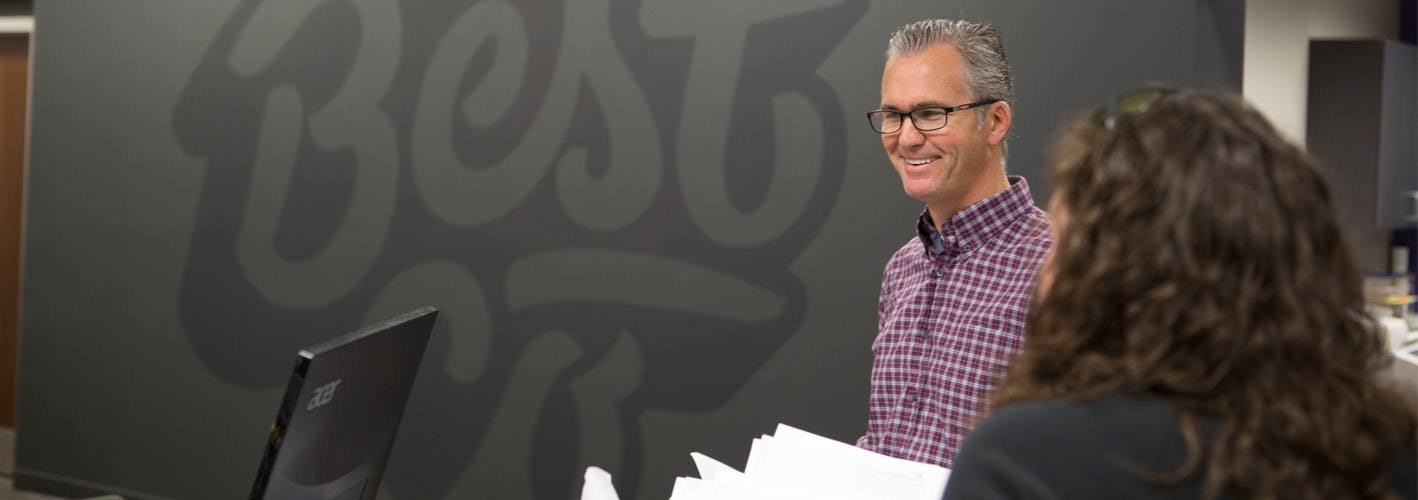 two marketers laughing in the office